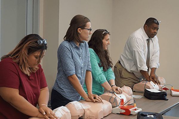 Students participating in CPR class